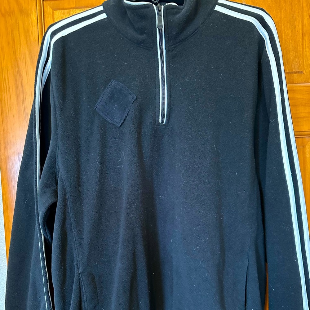 Black Adidas jacket with whit trim.  Great condition and light for windy days.